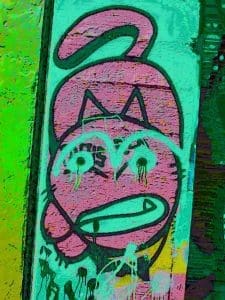 A sample glitch camera image taken of a graffiti cat - 1 of 2