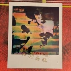 A Polaroid print of a piece of glitch art.